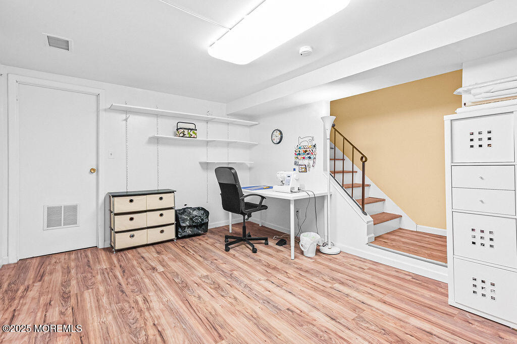 9 Tralee Road Hazlet, NJ 07730 - Photo 28 of 40 a view of a workspace with furniture and wooden floor