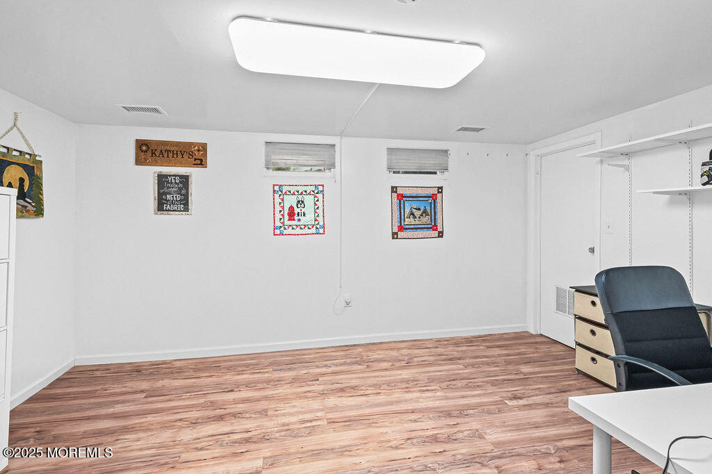 9 Tralee Road Hazlet, NJ 07730 - Photo 29 of 40 a view of room with hardwood floor and cabinet