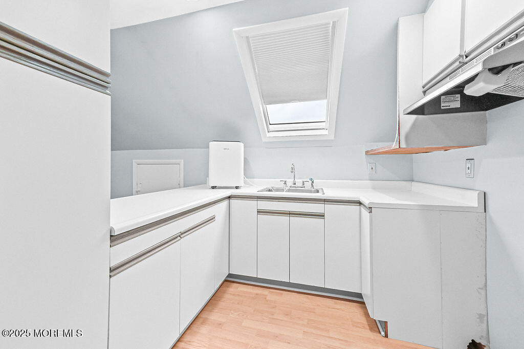 9 Tralee Road Hazlet, NJ 07730 - Photo 32 of 40 a bathroom with a sink and a mirror