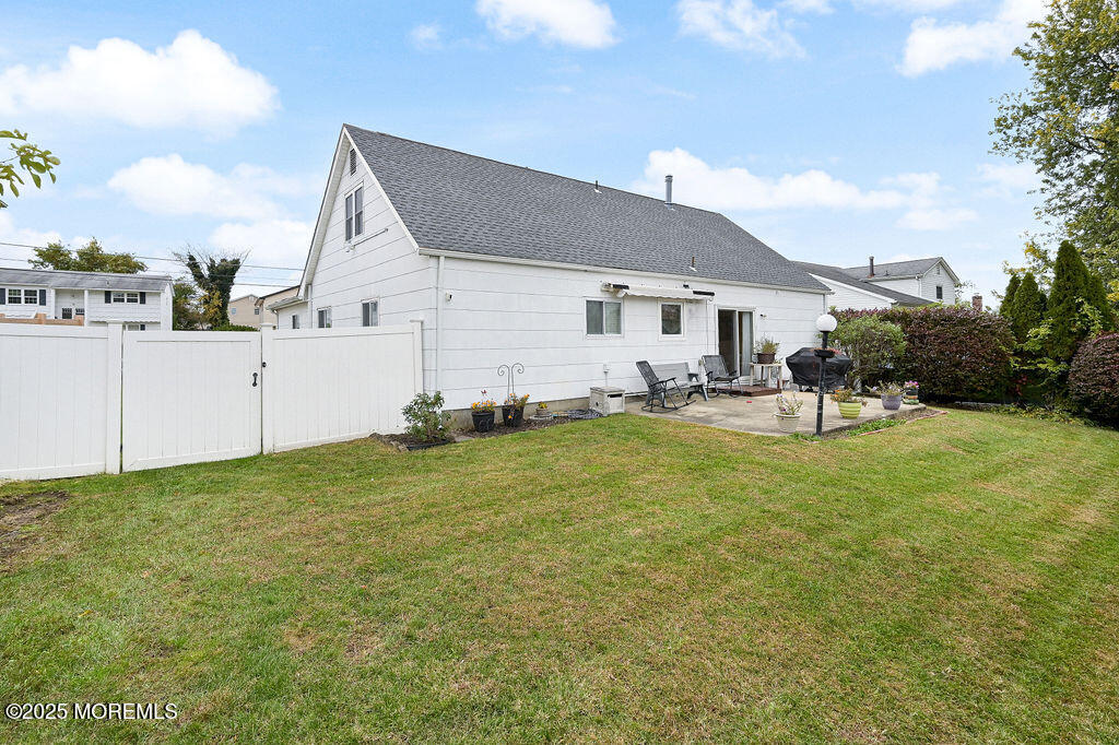 9 Tralee Road Hazlet, NJ 07730 - Photo 37 of 40 a backyard of a house with table and chairs
