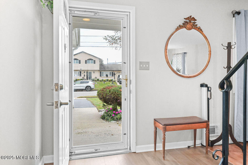 9 Tralee Road Hazlet, NJ 07730 - Photo 6 of 40 an entryway view with wooden floor and glass door