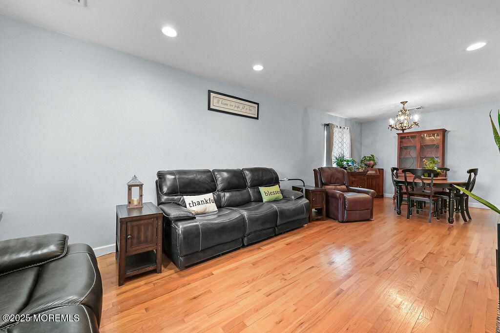 9 Tralee Road Hazlet, NJ 07730 - Photo 8 of 40 a living room with furniture and a wooden floor