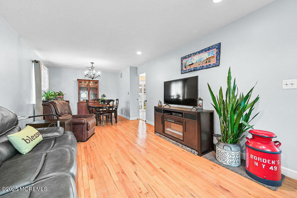 9 Tralee Road Hazlet, NJ 07730 - Photo 9 of 40 a living room with furniture and a flat screen tv