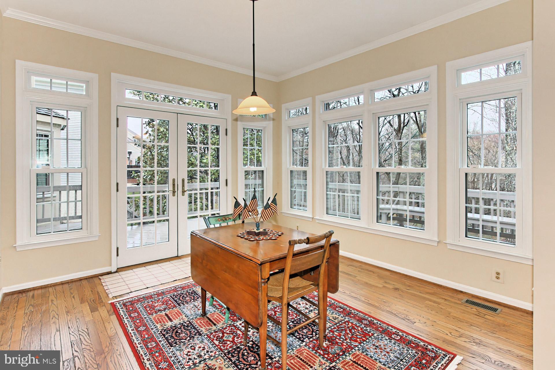 8126 Ridge Creek Way Springfield, VA 22153 - Photo 15 of 50 a living room with furniture and floor to ceiling windows