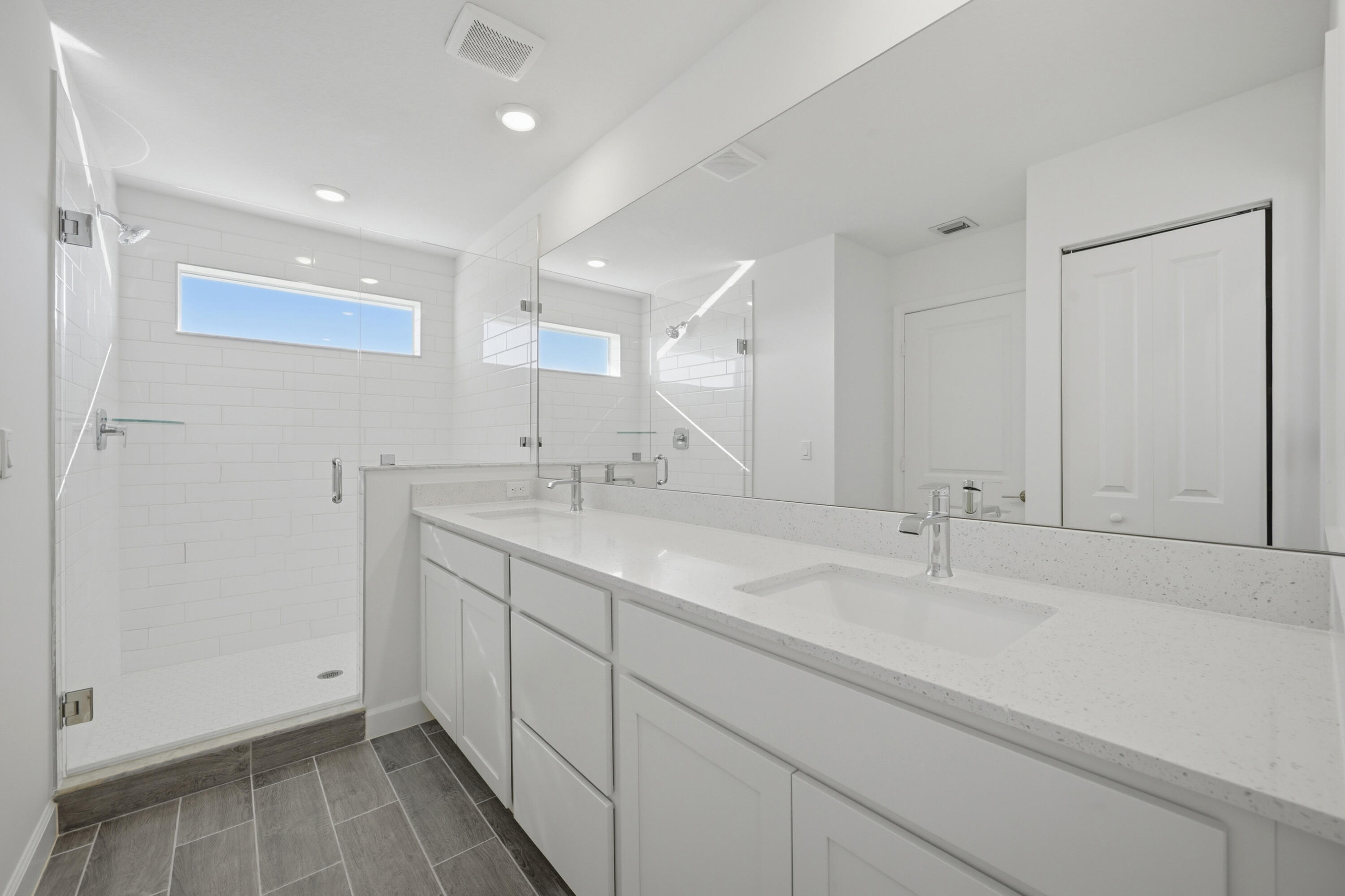 19568 Whispering Creek Road Loxahatchee, FL 33470 - Photo 19 of 30 a bathroom with a sink and a mirror