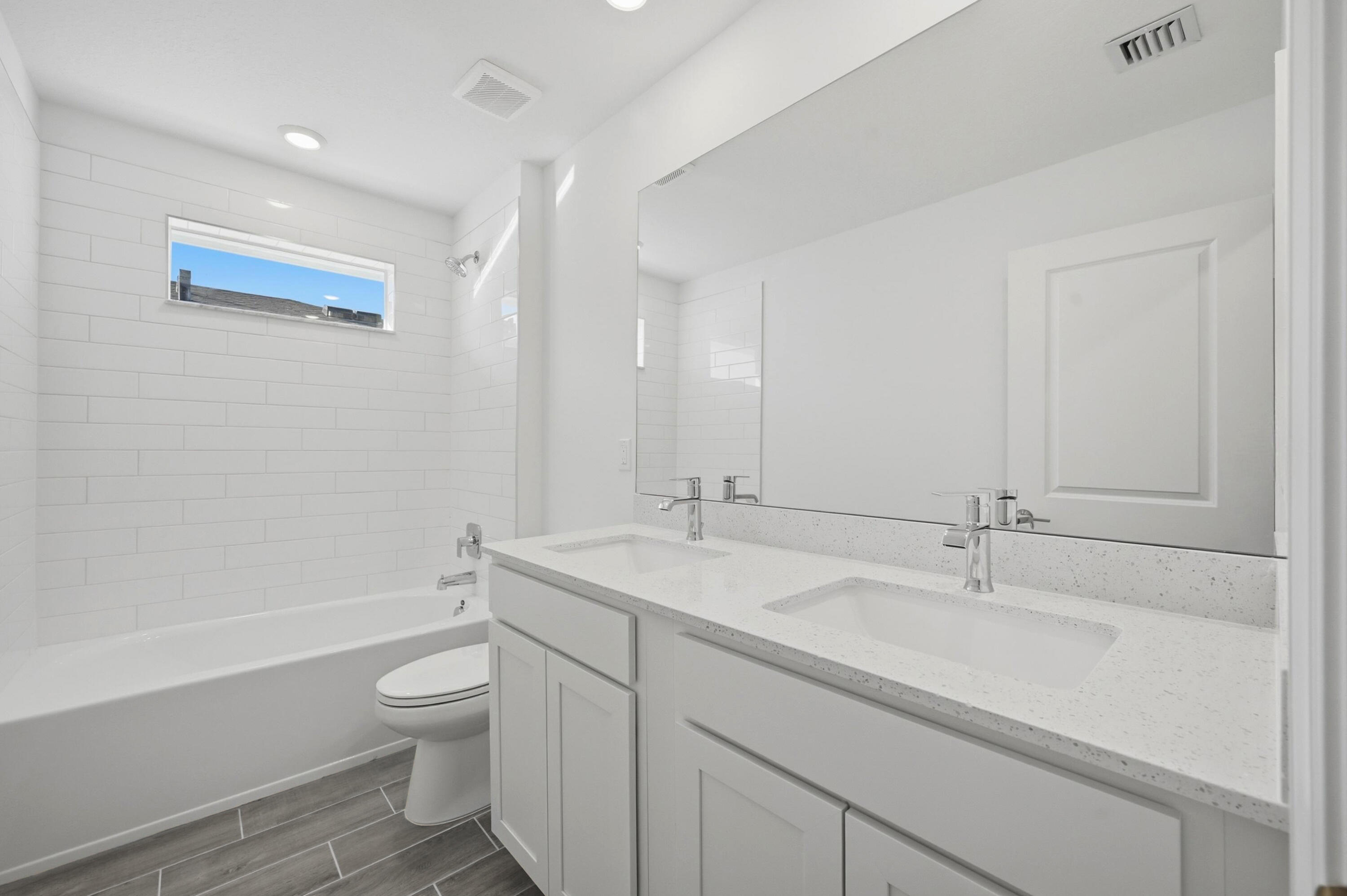 19568 Whispering Creek Road Loxahatchee, FL 33470 - Photo 22 of 30 a bathroom with a granite countertop sink mirror vanity and toilet