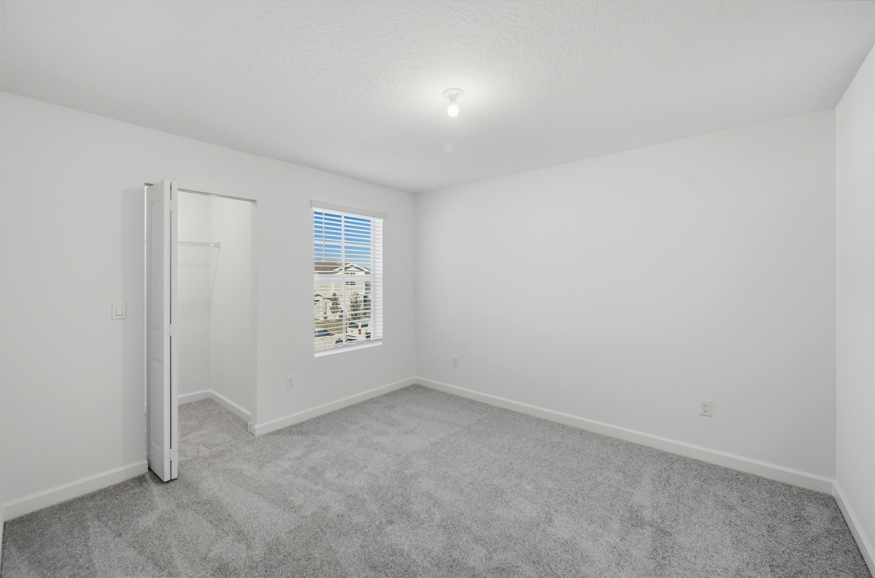 19568 Whispering Creek Road Loxahatchee, FL 33470 - Photo 25 of 30 an empty room with a empty space and window