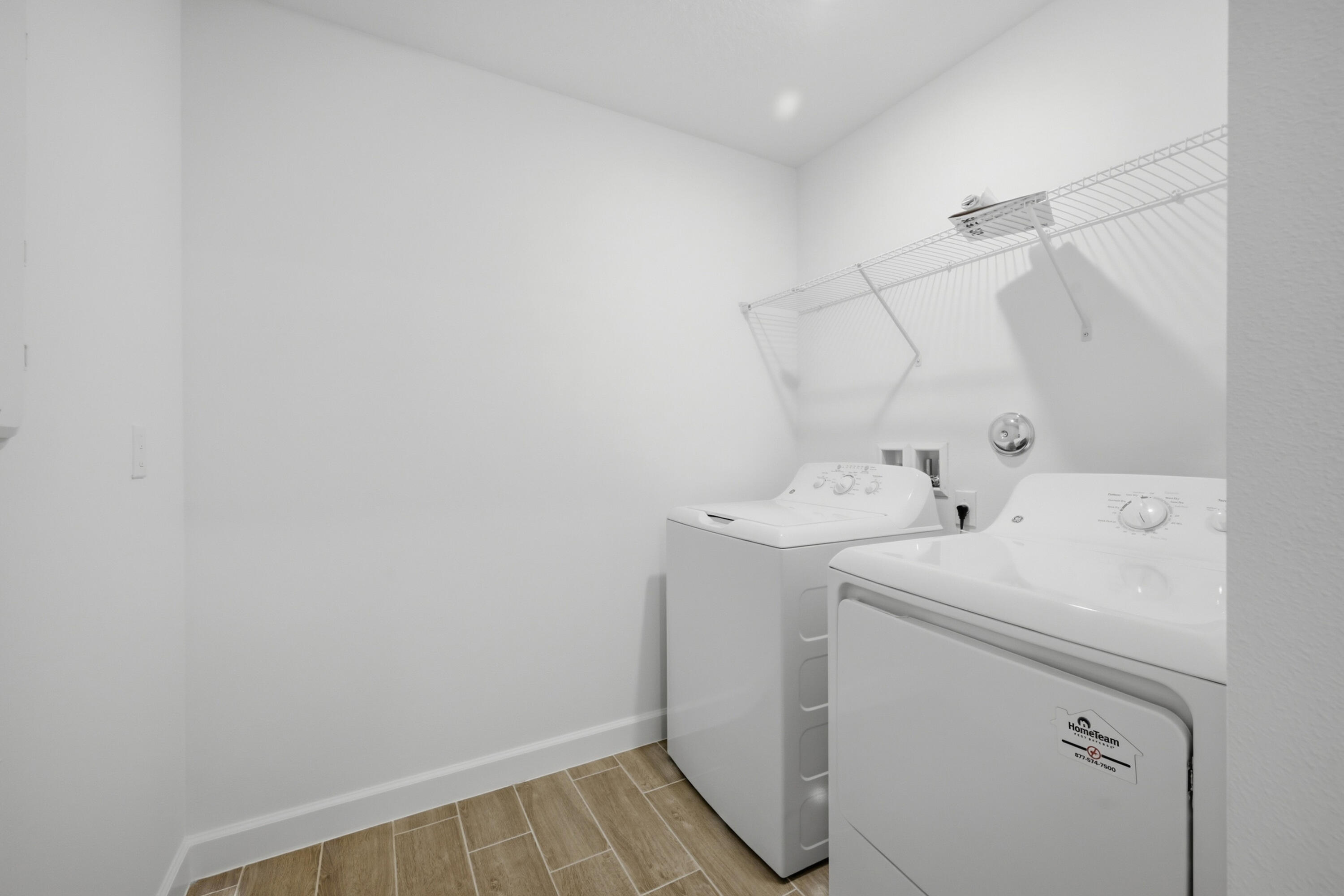 19568 Whispering Creek Road Loxahatchee, FL 33470 - Photo 28 of 30 a utility room with dryer and washer