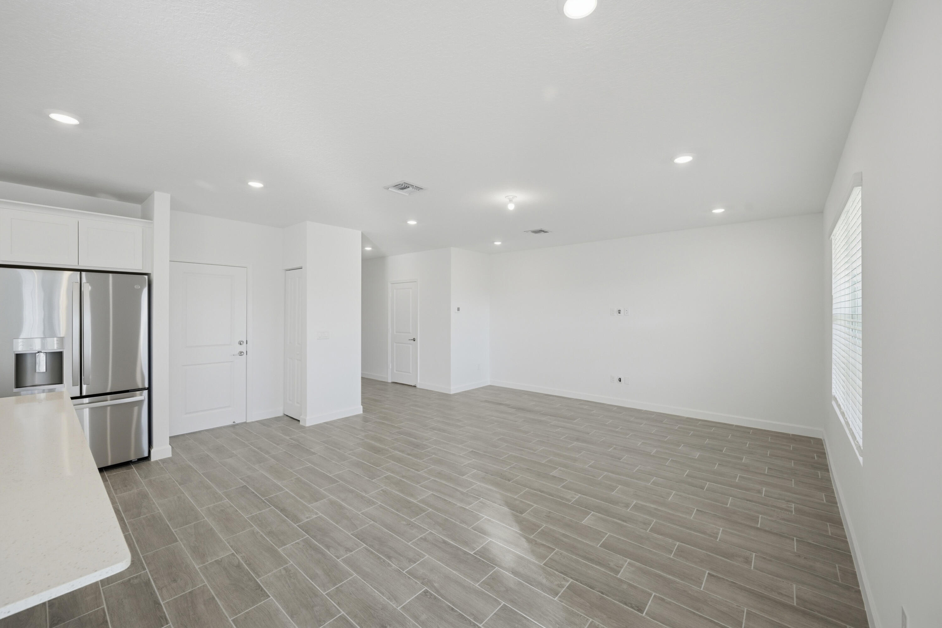 19568 Whispering Creek Road Loxahatchee, FL 33470 - Photo 6 of 30 an empty room with closet and windows