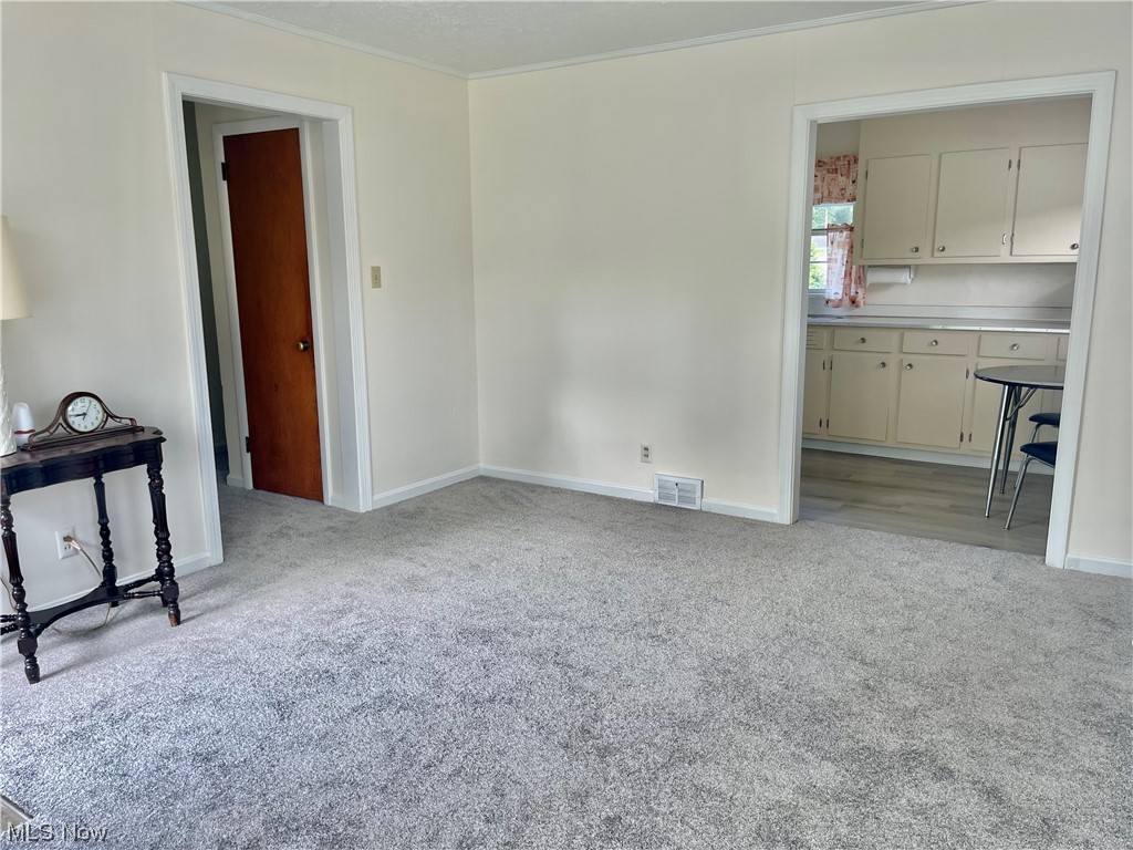 3002 Greer Road Akron, OH 44319 - Photo 4 of 12 From Living room to Kitchen to hallway. Notice the beautifully painted walls and brand new carpet waiting for you!