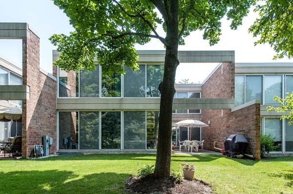 88 Avon Road, Unit 88 Northbrook, IL 60062 - Photo 14 of 17 a view of a house with a yard and plants