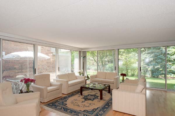 88 Avon Road, Unit 88 Northbrook, IL 60062 - Photo 4 of 17 a living room with furniture and a large window