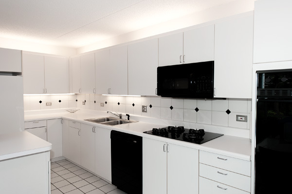 88 Avon Road, Unit 88 Northbrook, IL 60062 - Photo 7 of 17 a kitchen with a sink and white cabinets