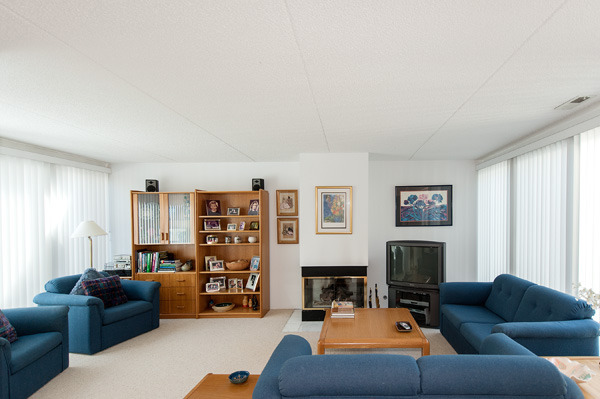 88 Avon Road, Unit 88 Northbrook, IL 60062 - Photo 8 of 17 a living room with furniture and a fireplace