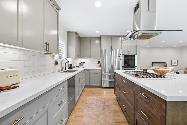 a living room with furniture and a mirror