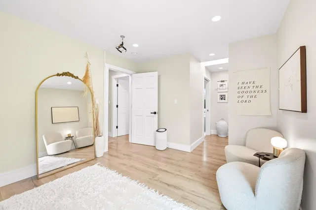 a bedroom with two beds and a dresser