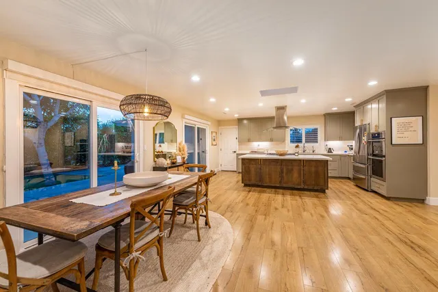 a view of a house with backyard and porch