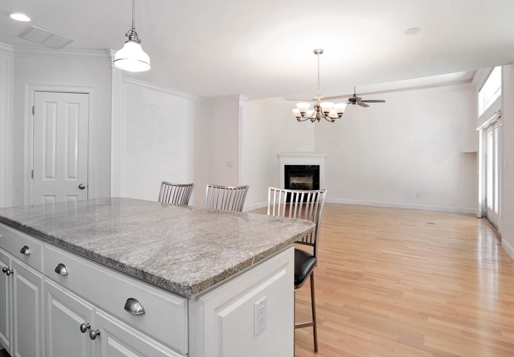20 Mariner's Drive, Unit 20 Marshfield, MA 02050 - Photo 11 of 26 a kitchen with stainless steel appliances granite countertop a sink a oven and a refrigerator