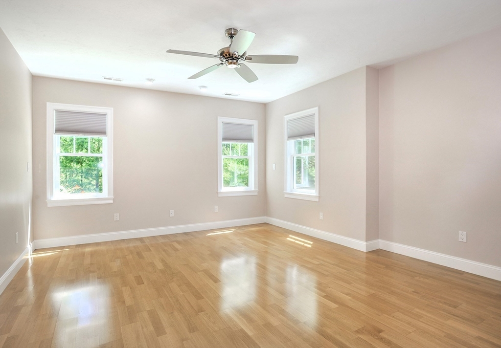 20 Mariner's Drive, Unit 20 Marshfield, MA 02050 - Photo 12 of 26 wooden floor in an empty room with a window