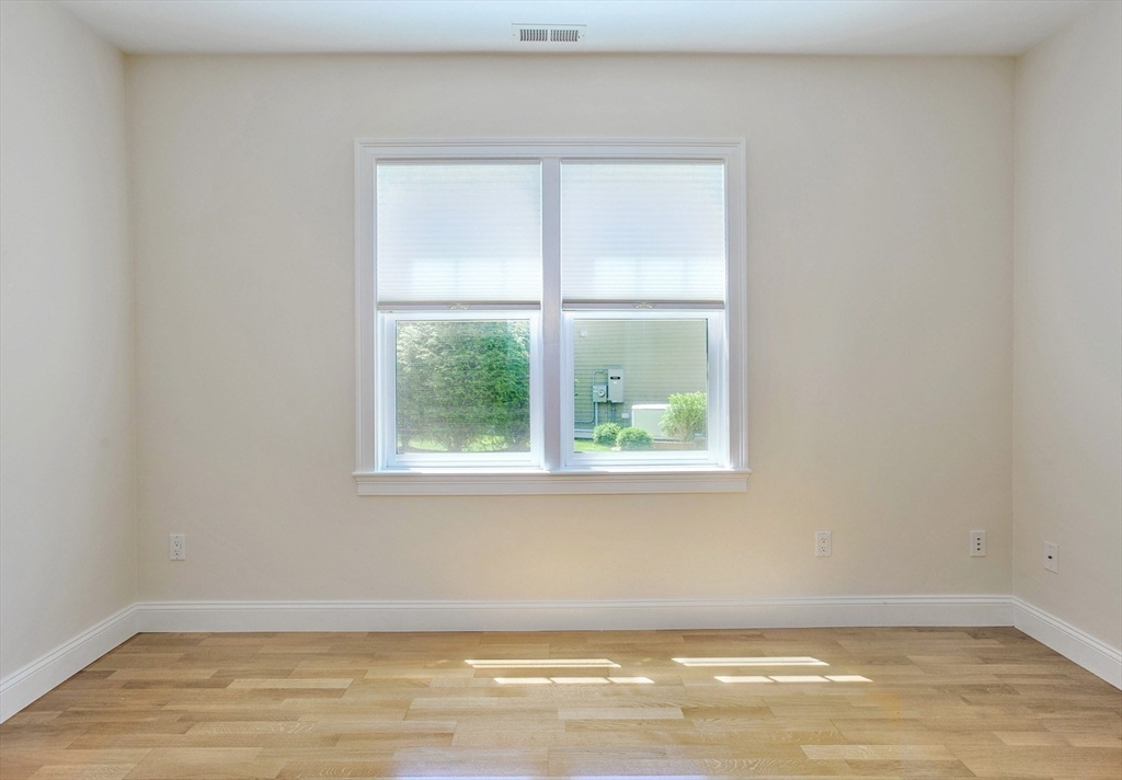 20 Mariner's Drive, Unit 20 Marshfield, MA 02050 - Photo 13 of 26 a view of a room with wooden floor and a window