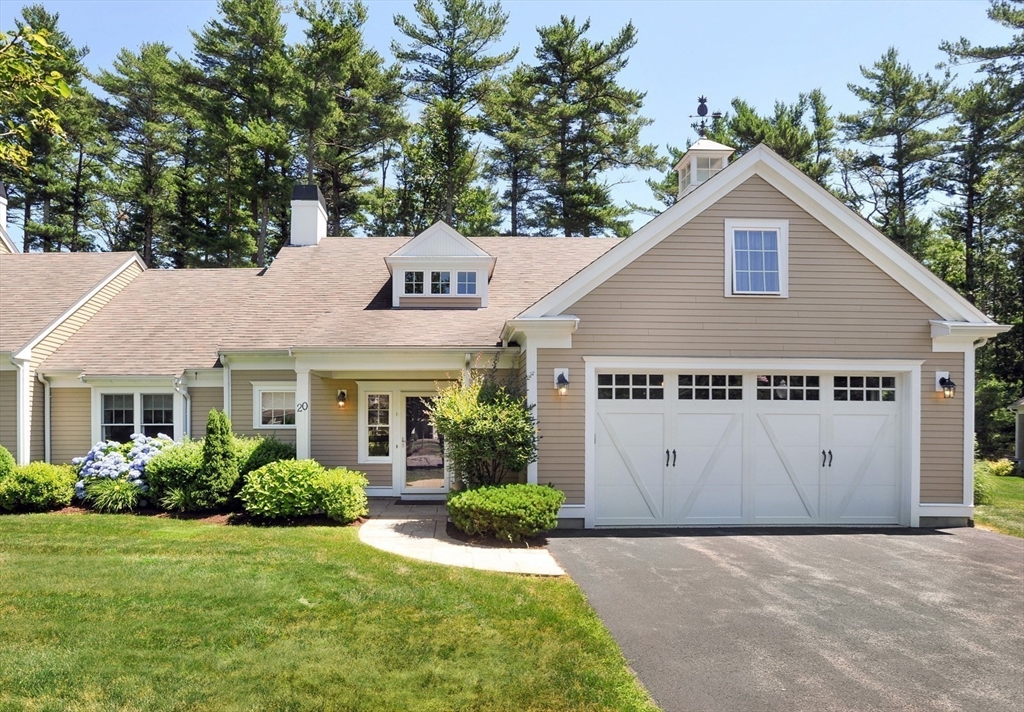 20 Mariner's Drive, Unit 20 Marshfield, MA 02050 - Photo 2 of 26 a view of a house with a yard and potted plants in front of door