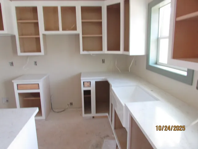 a view of balcony with wooden floor