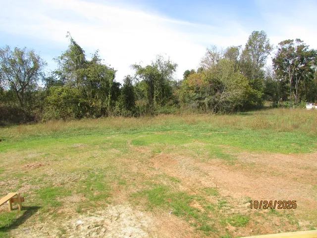a view of a lake with a big yard