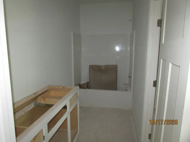 a bathroom with a sink and vanity