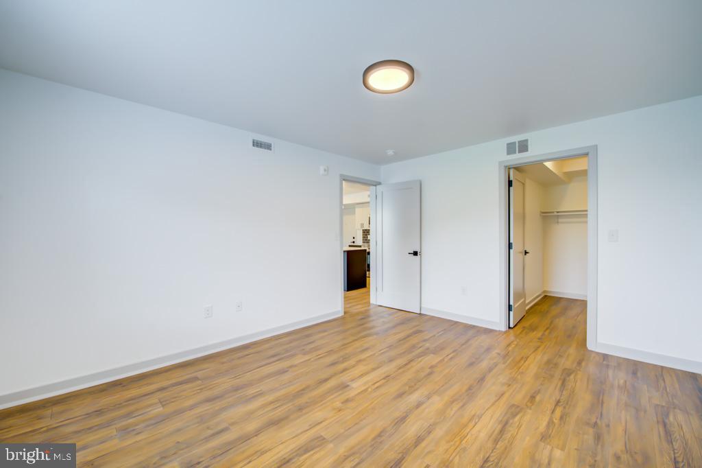 5001 Umbria Street, Unit P607 Philadelphia, PA 19128 - Photo 6 of 10 a view of an empty room and wooden floor