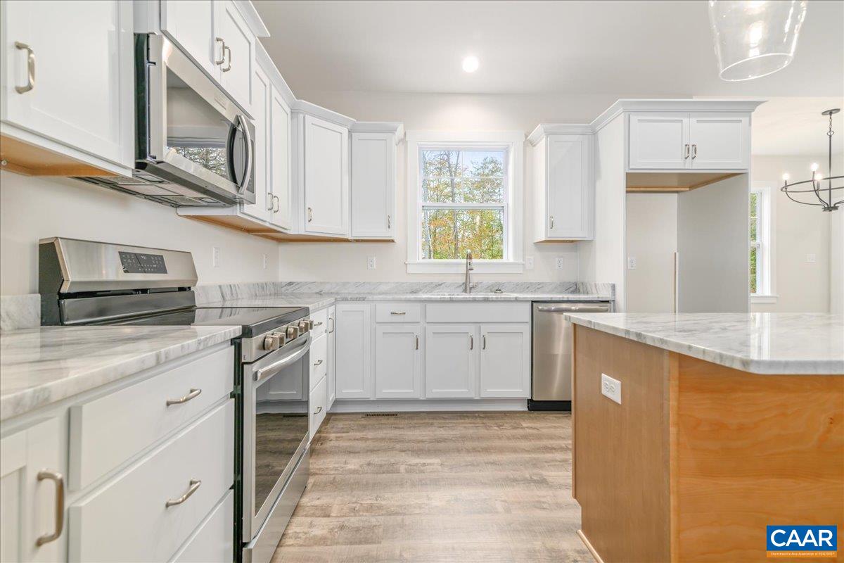 6443 Bremo Road Bremo Bluff, VA 23022 - Photo 11 of 31 a kitchen with stainless steel appliances granite countertop a sink and a stove