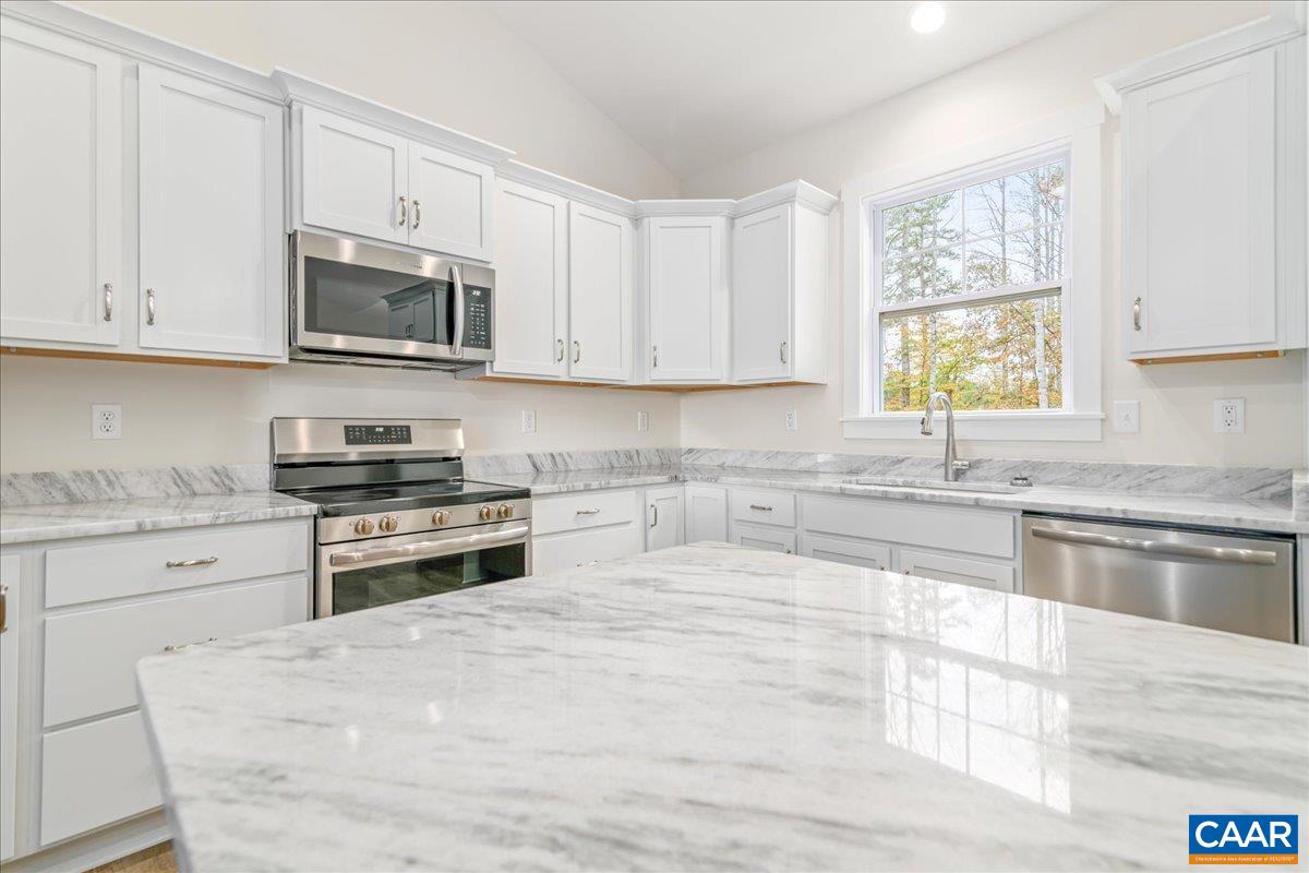 6443 Bremo Road Bremo Bluff, VA 23022 - Photo 12 of 31 a kitchen with stainless steel appliances granite countertop a stove a sink and a microwave