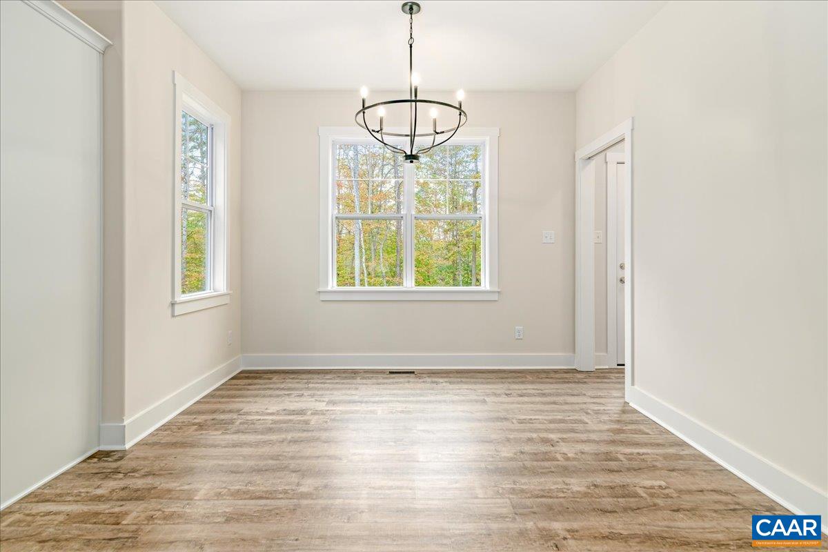 6443 Bremo Road Bremo Bluff, VA 23022 - Photo 15 of 31 a view of an empty room with wooden floor and a window