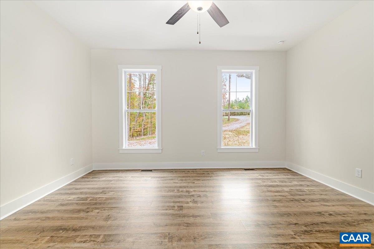 6443 Bremo Road Bremo Bluff, VA 23022 - Photo 20 of 31 wooden floor in an empty room with a window