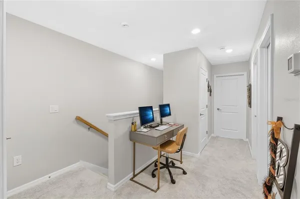 a view of a hallway with workspace