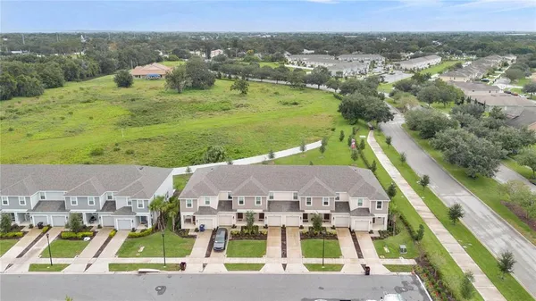 a view of multiple houses with a yard