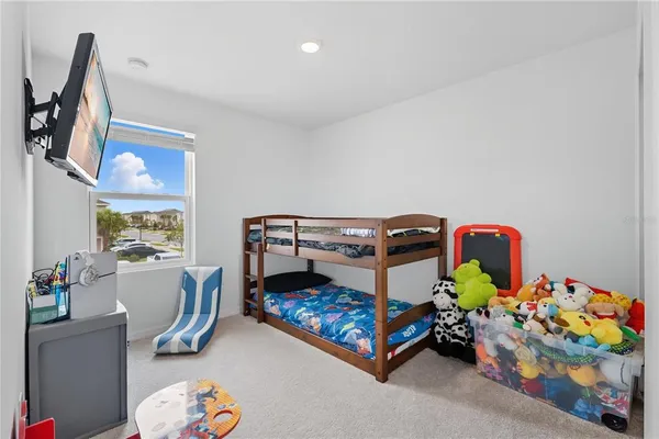 a bedroom with a bed and toys