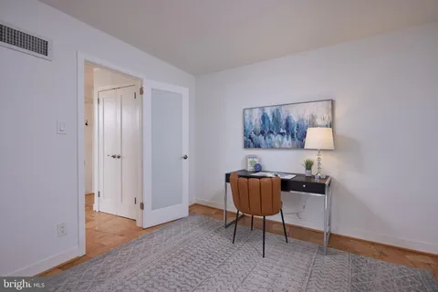 a livingroom with a workspace