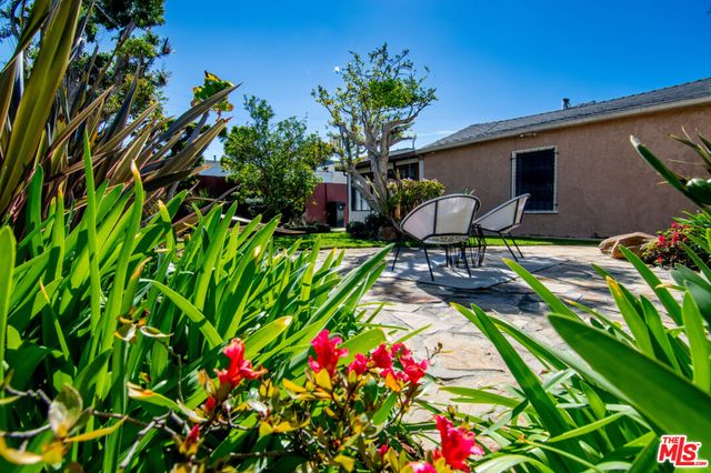 a view of swimming pool with sitting area