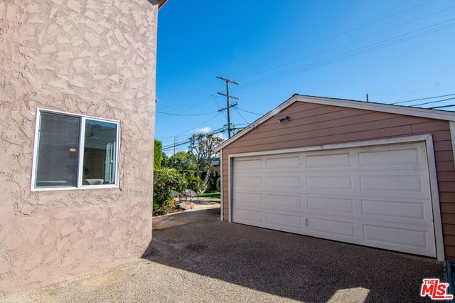 a view of house with backyard