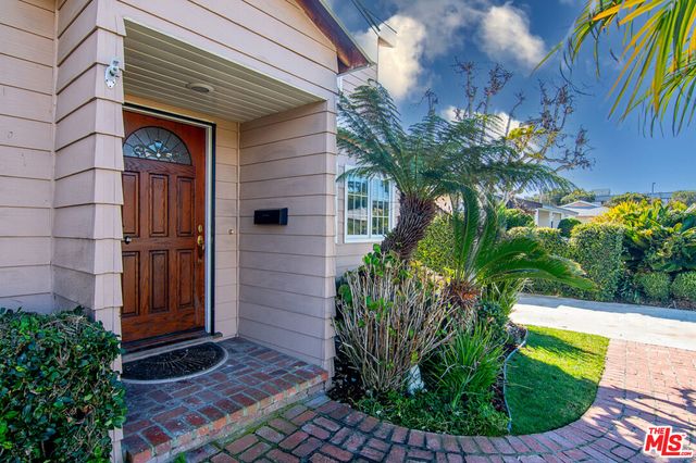a view of a house with a small yard