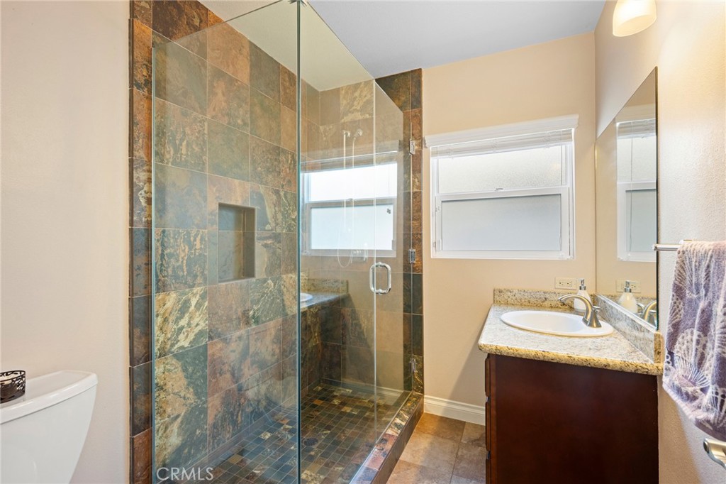 724 San Luis Rey Road Arcadia, CA 91007 - Photo 11 of 15 a bathroom with a double vanity sink mirror and shower