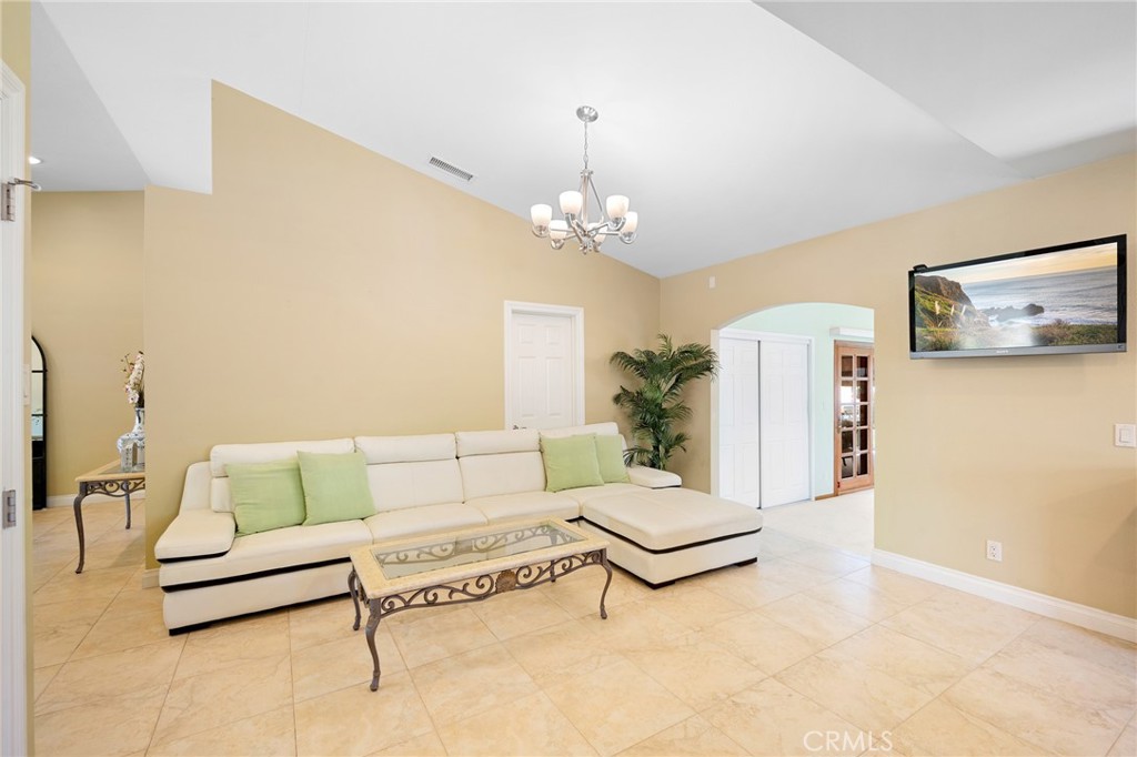 724 San Luis Rey Road Arcadia, CA 91007 - Photo 4 of 15 a living room with furniture and a chandelier