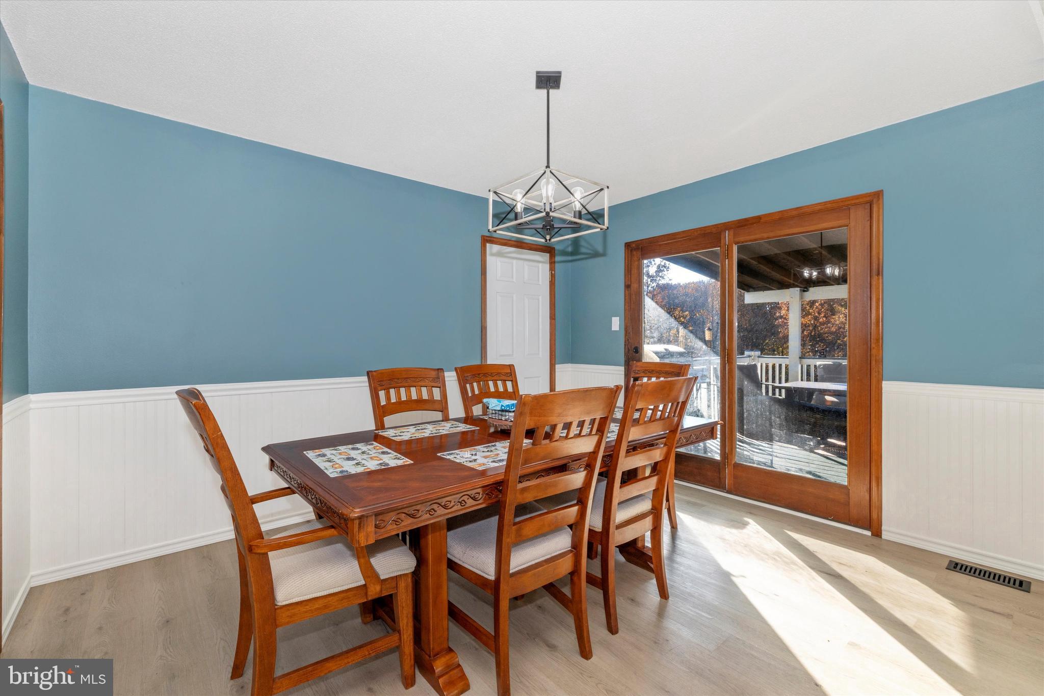 292 Bridget Road Martinsburg, WV 25404 - Photo 14 of 49 a dining room with a wooden table and chairs