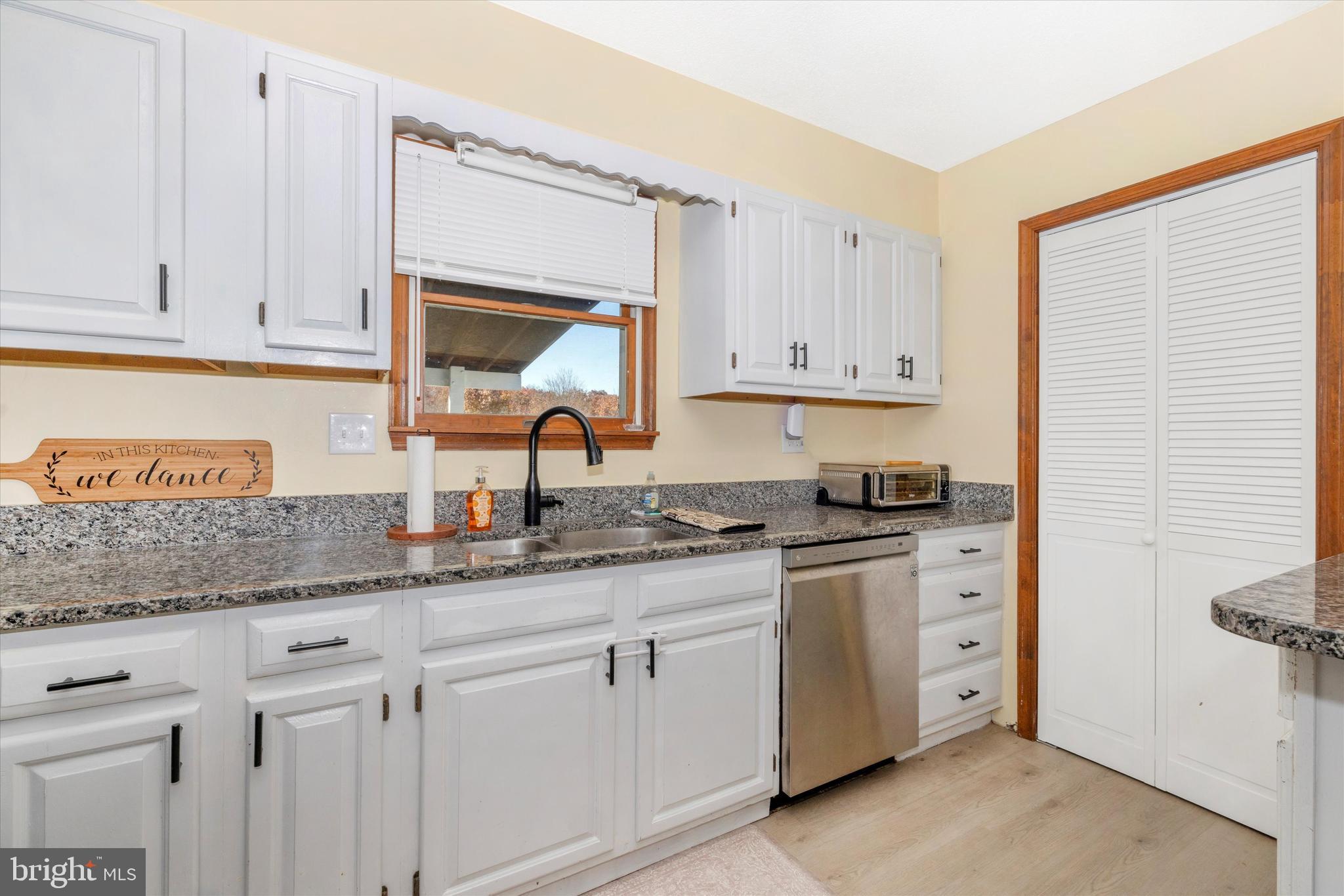 292 Bridget Road Martinsburg, WV 25404 - Photo 18 of 49 a kitchen with granite countertop white cabinets and white appliances
