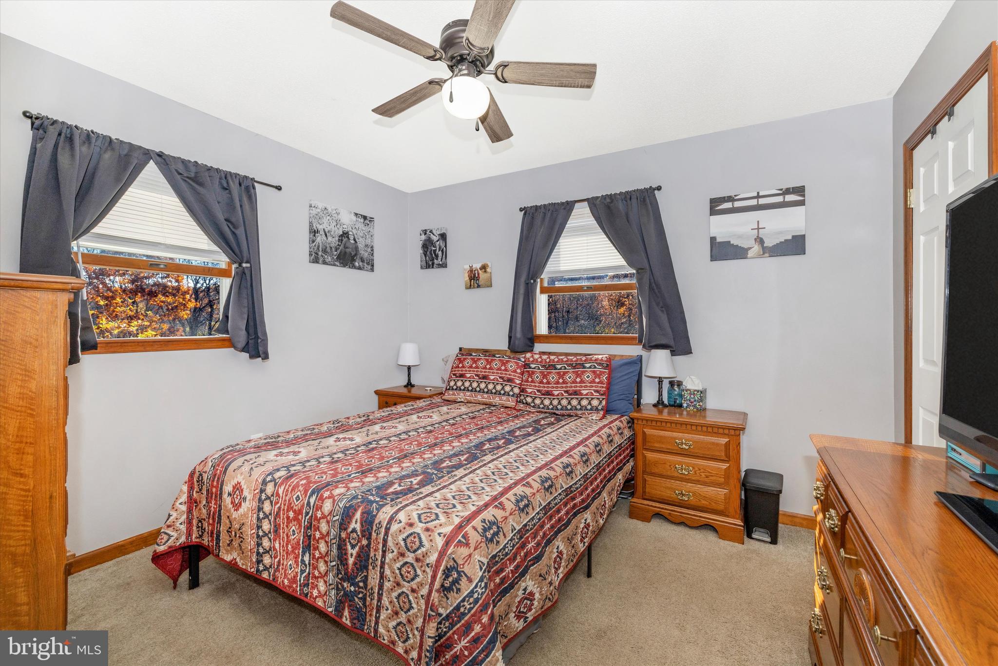 292 Bridget Road Martinsburg, WV 25404 - Photo 25 of 49 a bedroom with a bed next to a window with a flat screen tv