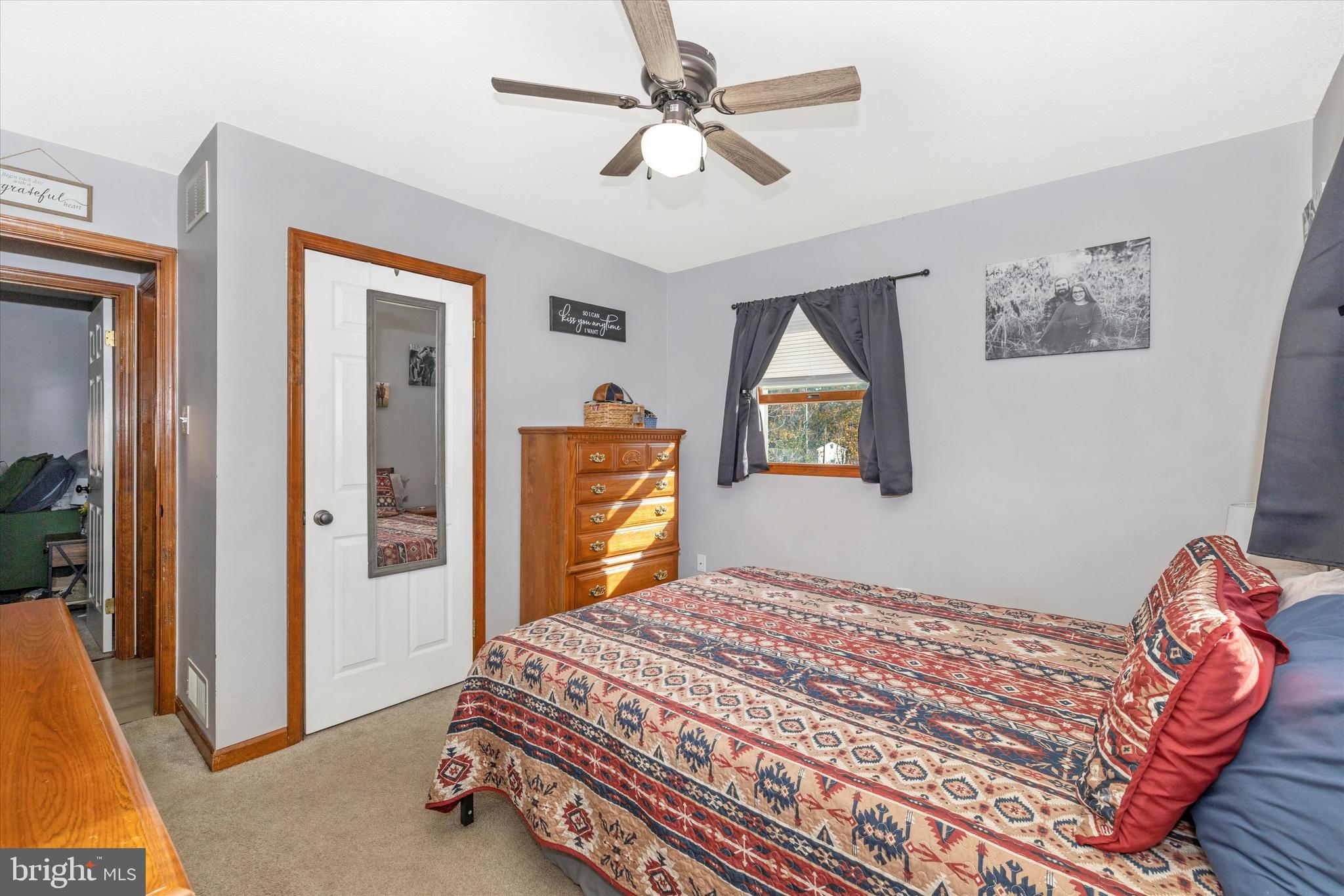 292 Bridget Road Martinsburg, WV 25404 - Photo 26 of 49 a bedroom with a bed and a chandelier