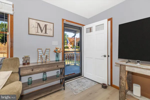 a room with furniture and flat screen tv