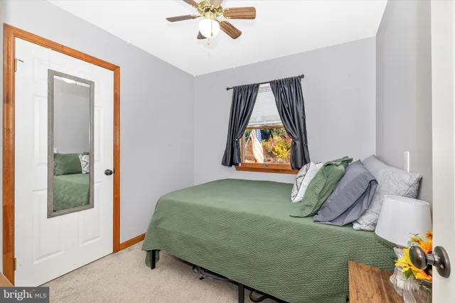 a bedroom with a bed and window