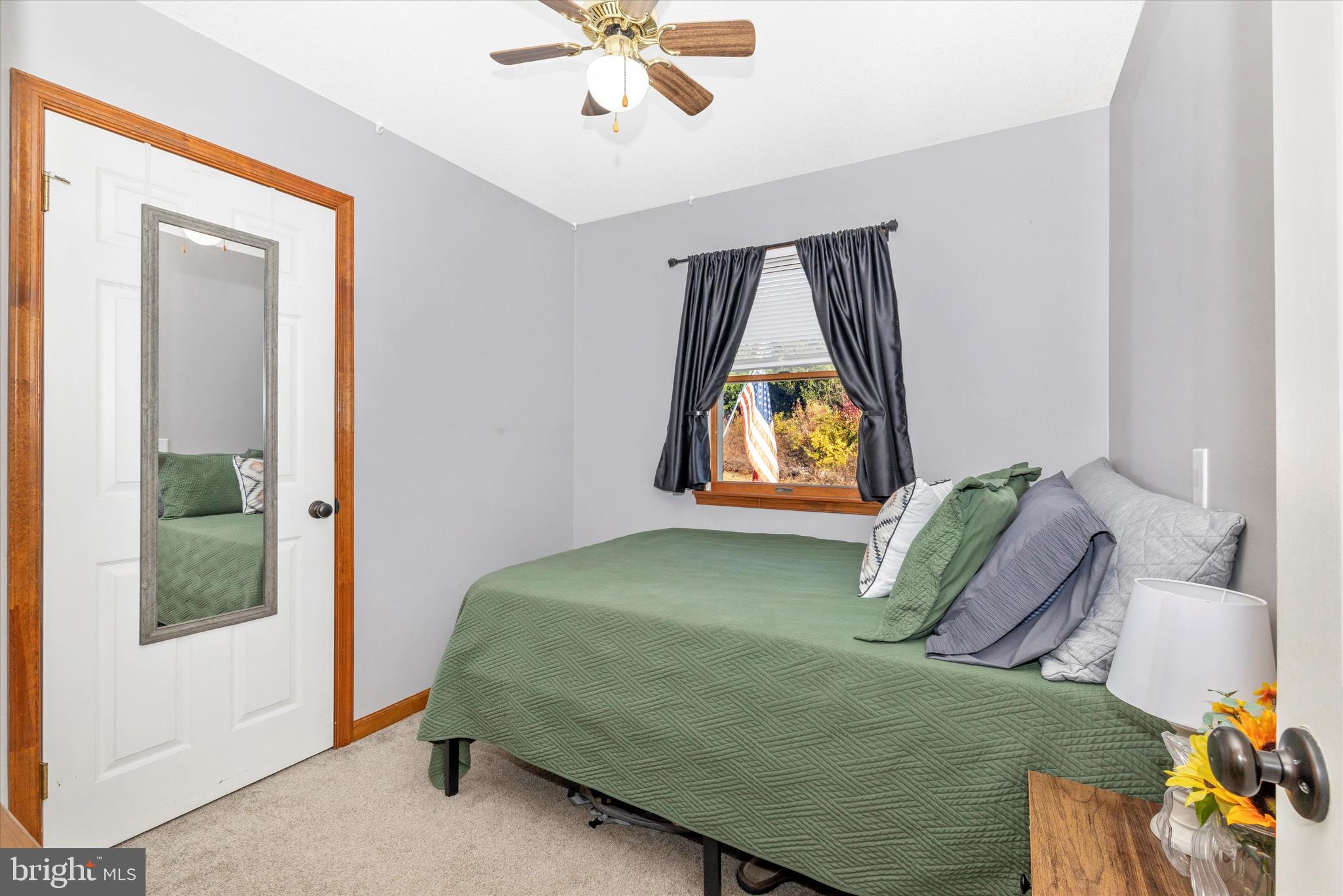 292 Bridget Road Martinsburg, WV 25404 - Photo 33 of 49 a bedroom with a bed and a painting on the wall