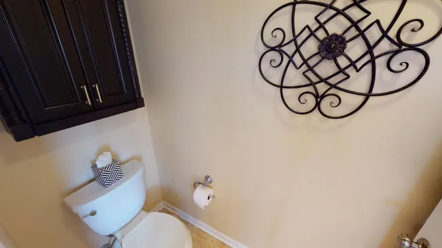 a bathroom with a toilet and a sink